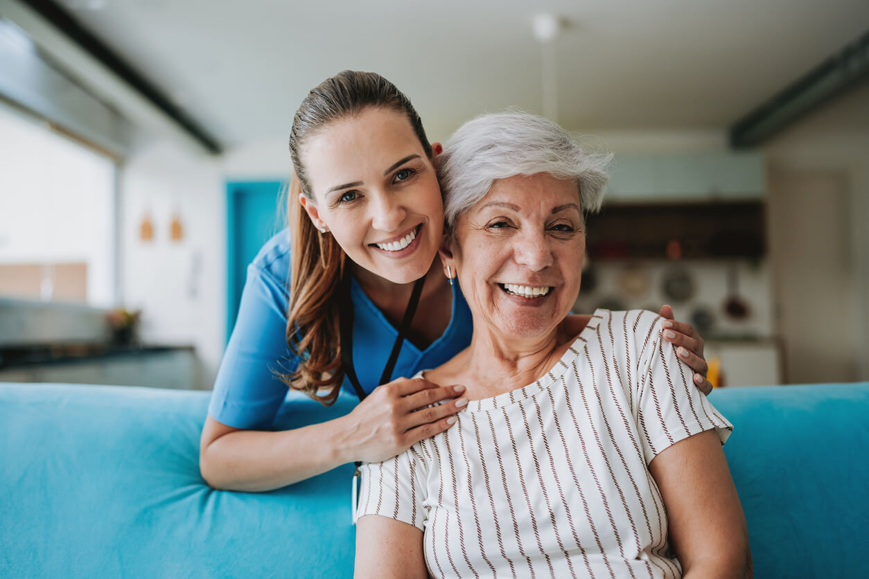 Female Caregiver smiling with female patient