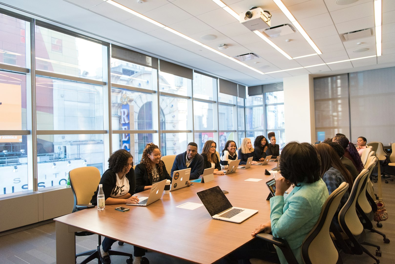 group of diverse people sitting in a conference room